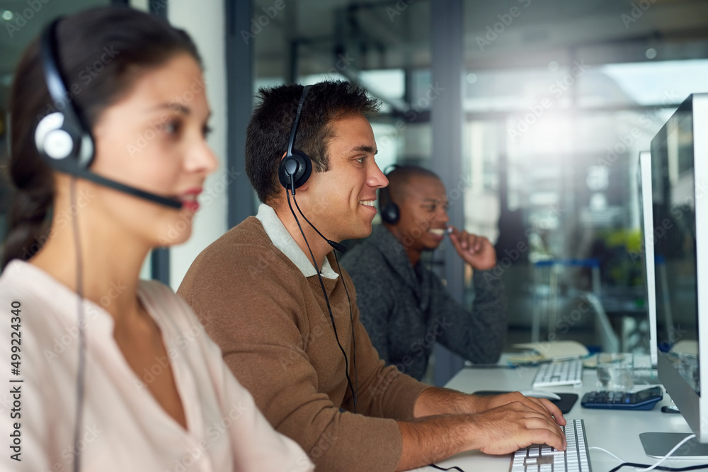 Poster Striking sales one after another. Shot of call centre agents working in an office.