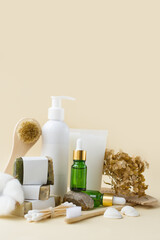 Eco cosmetic products for skin care of face and body. White tubes with natural creams, soap, and bottle with essence oil, minerals, vitamins, prebiotics