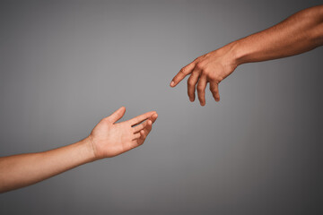 Get in touch with your classical side. Studio shot of unidentifiable hands reaching for each other...