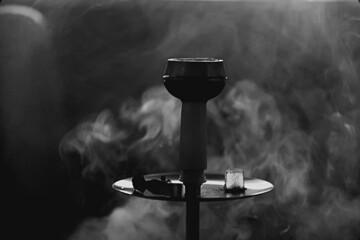 hookah smoke bowl with tobacco dark arabic style background