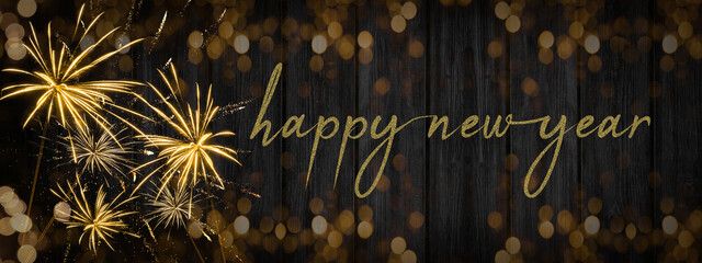 Fototapeta na wymiar HAPPY NEW YEAR 2023 - Festive New Year's Eve firework background panorama greeting card banner long - Golden fireworks on dark wood wall texture