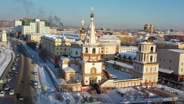 Aerial around view on the Cathedral of the Epiphany and Angara river in Irkutsk, Russia, 4k