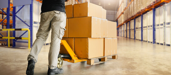 Workers Unloading Packaging Boxes on Pallet in Storage Warehouse. Cardboard Boxes. Shipping...
