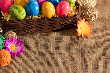 Collected Easter eggs into a brown wicker basket in time for Easter.