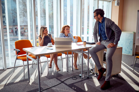 Group of casual colleagues chatiing on a break