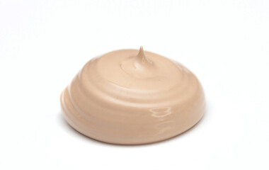 Foundation with smears as a sample on a white background. Makeup cosmetics. Tone cream. Concealer texture.