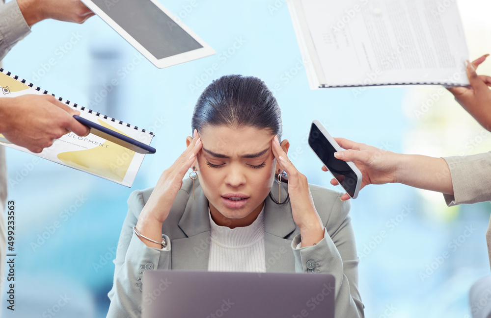 Wall mural Always set healthy boundaries. Shot of a young woman having a stressful day at work.