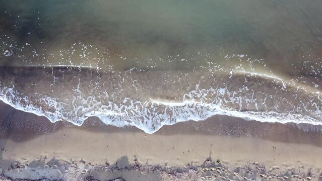 Breathtaking aerial view flight slowly tilt up drone flight of waves on coastline of
natural golden sand Bouka Beach at Corfu Greece is a paradis 4k Cinematic view from above by Philipp Marnitz 2022