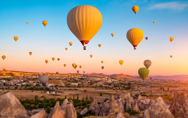 Bright hot air balloons in sky of Cappadocia, Turkey - obrazy, fototapety, plakaty