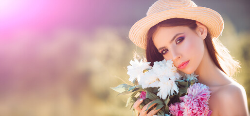 Beautiful spring woman in blooming tree. Portrait of young beautiful woman in spring blossom trees. Beauty woman face. Banner for header website design, copy space.