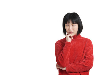 Young asian woman touching her chin with pensive expression, isolated.