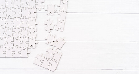 Matching pieces of empty puzzle on white background