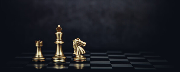 Close-up king chess standing with teamwork on chess board concept of team player or business team...