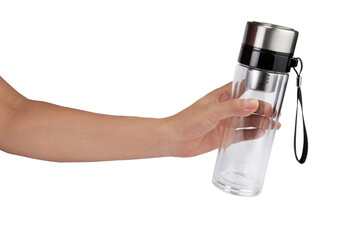 Hand holding a glass water bottle for travel isolated on white