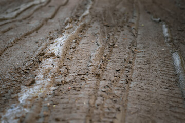 Mud on the road, dirt road in spring, rural dirt road after rains in spring,