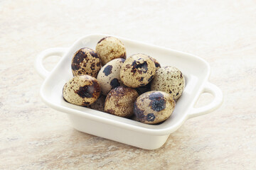 Raw quail eggs heap in the bowl