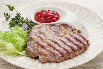 Grilled pork neck steak with ketchup