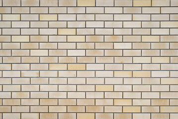 Brick yellow smooth wall outdoors. Texture background