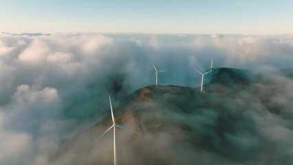 Wind turbines produce electricity in the mountains.