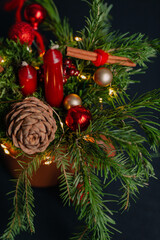 beautiful Christmas composition in a mug with a candle