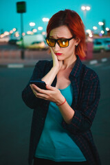 Girl gets fined for illegal parking. Inexperienced driver at evening city background.