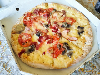 delicious pizza in a box on the table