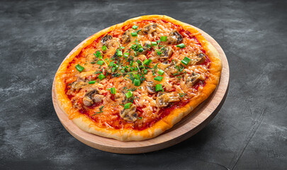 Juicy pizza with mushrooms, tomatoes, cheese and fresh herbs.