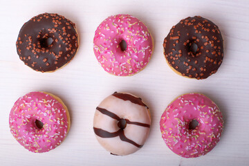 chocolate ,Pink donats, Sweet breakfast. Stack of pink and white donats on a white background