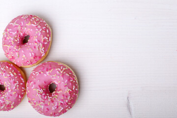 Pink donats, Sweet breakfast. Stack of pink and white donats