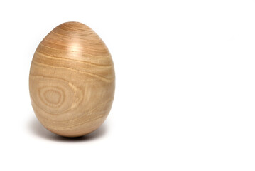 Closeup hardwood turned Easter egg white background