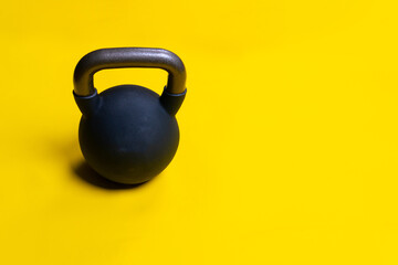 Obraz na płótnie Canvas Black space isolated yellow kettlebell ackground fitness cast dumbbell, from equipment sport for steel for athletic red, knockout winner. Sportswear fighter boxer, rivalry