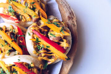 A closeup shot of steamed bao buns on marble table