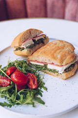 Healthy breakfast, sandwich on a marble table.