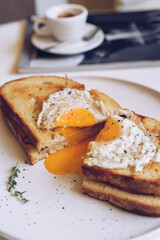 Croque madame, french toast with poached egg, ham and cheese