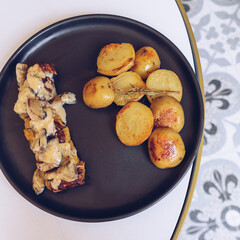 Lunch, roasted pork with potato, top view.