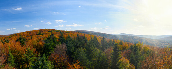 Wide panorama of idyllic autumn mountains landscape on a sunny day in the Carpathian Mountain Range, Poland