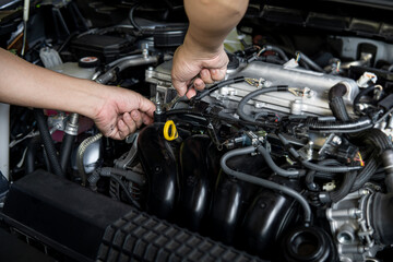 Fototapeta na wymiar Man use Open-ended wrench for basic car repairs by yourself in engine room , car service concept