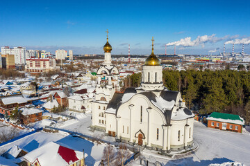 Surgut city in winter. The church in honor of St. Nicholas. Aerial view.