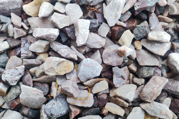 Crushed gravel texture. Closeup pebble pattern. Grunge gravel road background