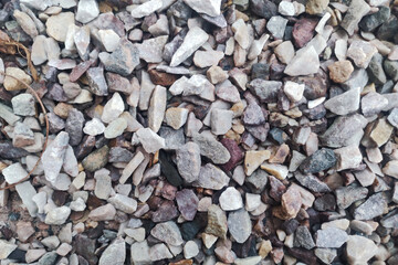 Crushed gravel texture. Closeup pebble pattern. Grunge gravel road background