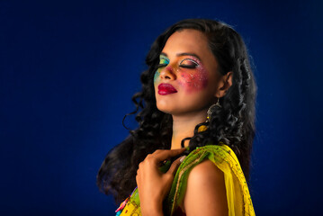 Fototapeta premium A gorgeous Young model beautiful woman or girl with perfect art creative makeup like a butterfly.