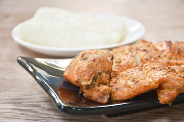 roasted slice chicken breast eat with sticky rice on plate