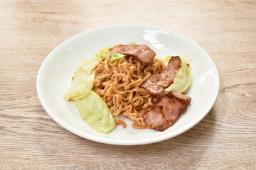fried yakisoba Japanese noodles slice pork bacon and cabbage on plate