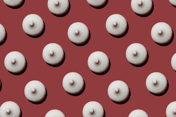 candy in the form of nipples pattern on a red background