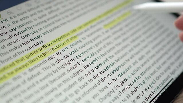 Closeup Highlighting Text Document on a Tablet Screen With a Stylus