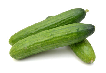 Cucumber and slices isolated over white background.
