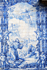 Fototapeta na wymiar religious panels of Azulejos on the wall of theChapel of the Souls in Porto, Portugal