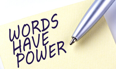 Sticky Note Message WORDS HAVE POWER with pen on white background