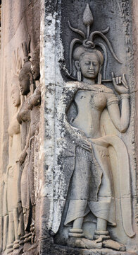 Intricate stone carving in the ancient temple of Angkor Wat - a display of the arts and culture of the Khmer empire from centuries ago