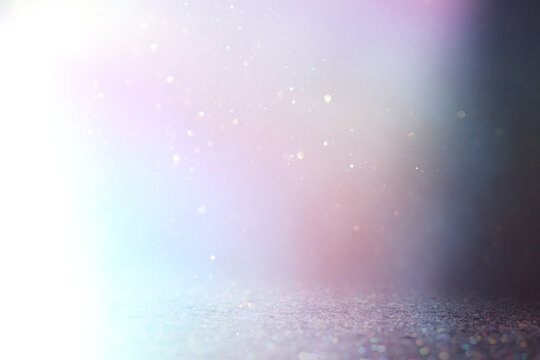 background of abstract gold, blue, pink, purple and silver glitter lights. defocused